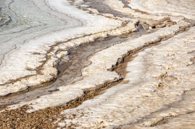 The salty shore of Dead Sea, salt crystals, salt bottom, Dead Sea Mud, there is no life , impossible to drown