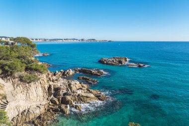 Sunny blue sky on coastline of the Mediterranean Sea (Costa Brava, Catalonia, Spain)