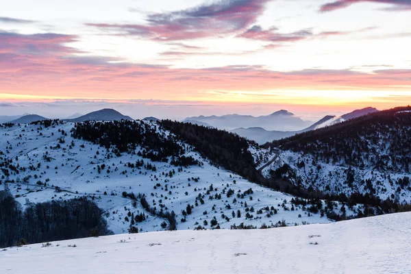 Colorful sky on a winter mountain sunrise.