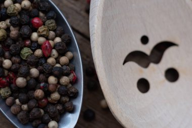 Various colored pepercorns on a dark background