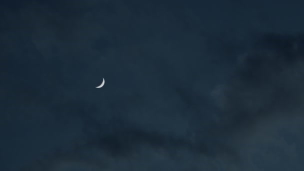 Wedge of moon in the blue sky with clouds — Stok video