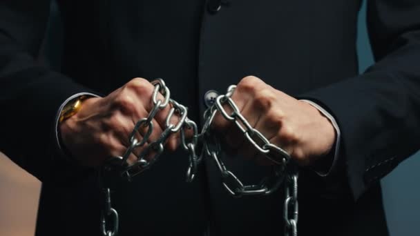 Man dressed in jacket with chain on hands — Stock Video