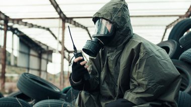 soldier seeks radio contact in radioactive area