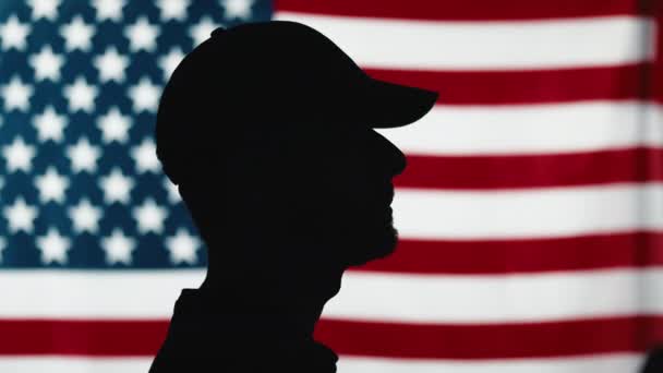 Silhouette of soldier saluting close up — Video Stock
