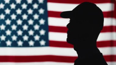 silhouette of soldier saluting close up
