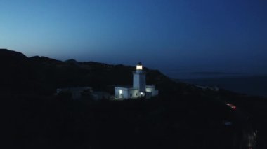 Aerial view of lighthouse by night 