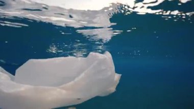 Close up of plastic waste floating in the ocean