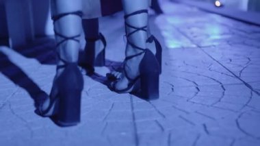 Close up of woman foots in the disco 