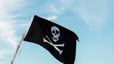 Close up of Pirates Flag on blue sky