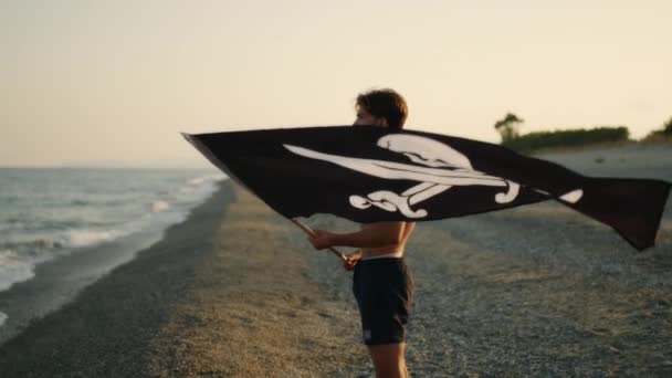 Boy Waves Pirate Flag Beach — Vídeos de Stock