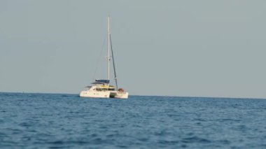 Aerial view of moored sailboat in the ocean 