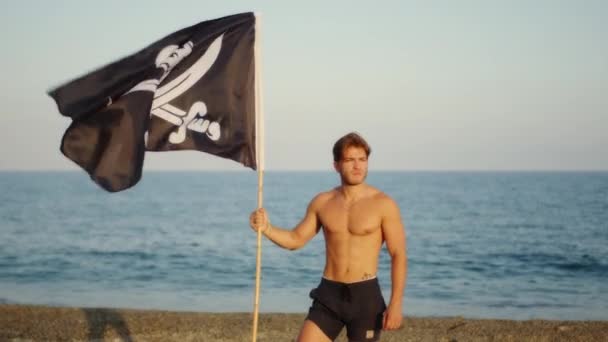 Boy Waves Pirate Flag Beach — Vídeo de Stock