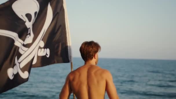 Boy Waves Pirate Flag Beach — Stockvideo