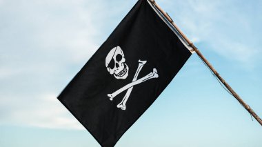 Close up of Pirates Flag on blue sky