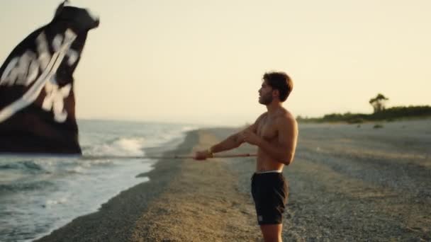 Boy Waves Pirate Flag Beach — Vídeo de Stock