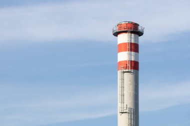 the pipe on the chimney, blue sky background