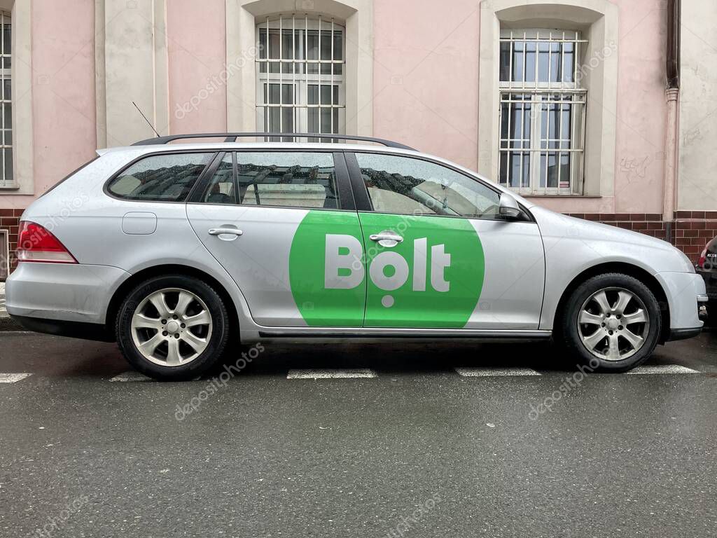 Prague, Czech Republic - February 16 2022: Silver car of Bolt company parked on the street in Prague Karlin in Czech Republic. High quality photo
