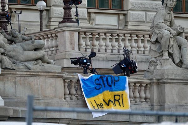 Ukrain flag with the inscription Stop the WAR on the railing of the stairs of National Museum building on Prague as support to Ukraine.