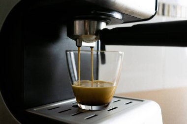 Coffee machine preparing a cup of coffee