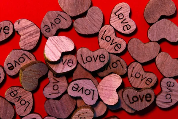 Many Small Wooden Hearts Foreground Written Word Love Valentine Day — 스톡 사진