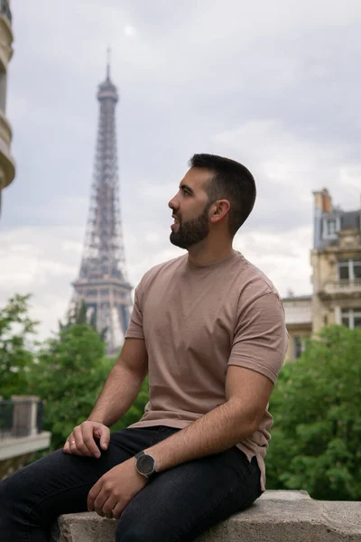 Young men in the foreground with the eiffel tower in the background