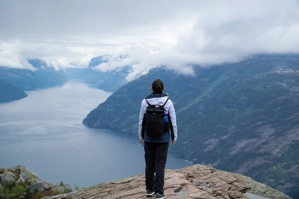 Unrecognizable woman with Lysefjord in the background
