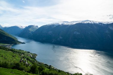 Beautiful Naerofjord with high mountains and waterfall in Norway