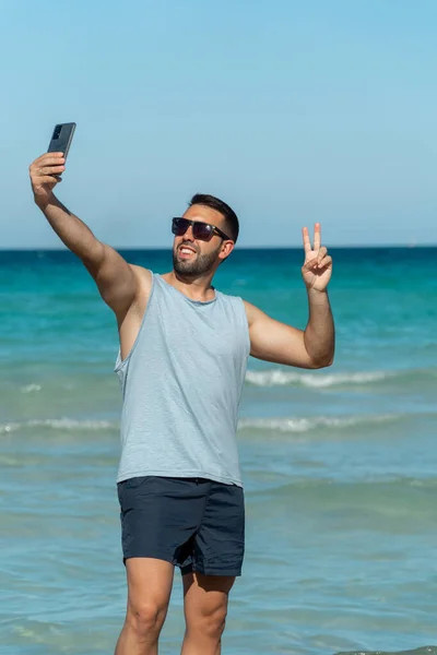 Young Man Beard Sunglasses Taking Selfie His Smartphone Beach Sunny — Stockfoto