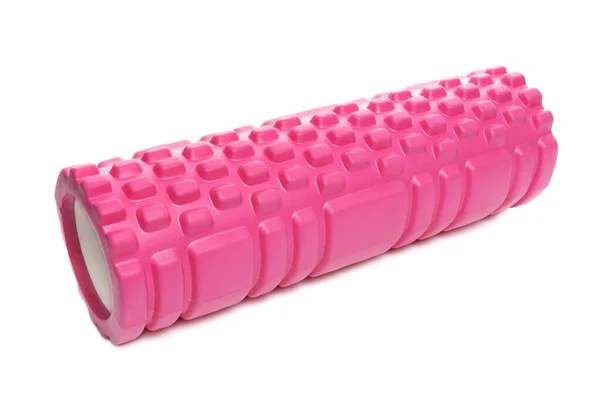 粉红按压辊由块状泡沫制成 泡沫滚动是运动员和理疗师用来抑制过度活跃肌肉的一种肌肉放松技术 — 图库照片