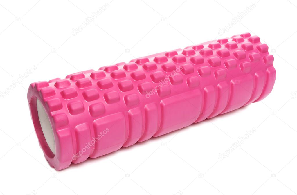 Pink massage roller made of lumpy foam. Foam rolling is a myofascial relaxation technique used by athletes and physical therapists to suppress overactive muscles