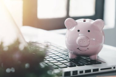 Piggy bank on laptop computer, Concept financial business investment, business, finance, investment, financial planning..