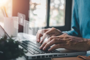 Businessman hand using laptop computer with document management icon, Document management data system business internet technology concept.	