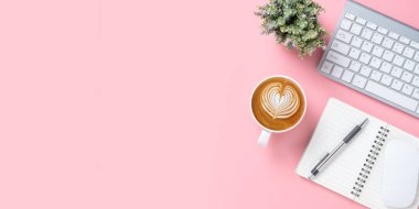 Office desk with keyboard computer, Pen, notebook, Cup of coffee on white background, Top view with copy space, Mock up.	