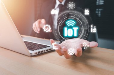 IOT Internet of things, Person hand holding VR screen Internet of things icon background, Digital transformation, Modern technology concept.	