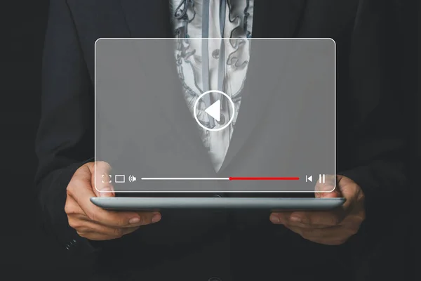 Video streaming on internet, Person watching online movie or TV series on digital tablet computer, Concept about subscription based live digital stream.