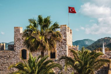 National flag of Turkey on the castle wall in Marmaris 