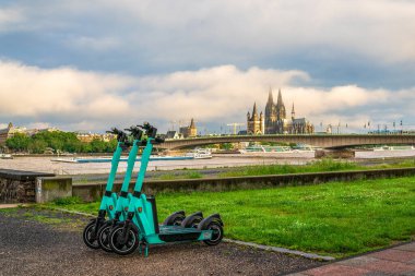 E-scooters on Cologne's Rhine promenade, Germany.