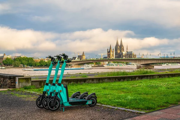 E-scooters on Cologne's Rhine promenade, Germany.
