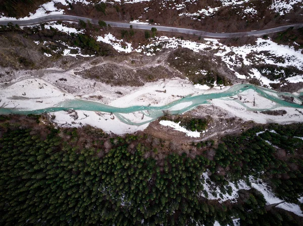 Turquoise Lake Running Snow Trees — стоковое фото