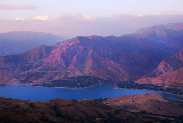 Chirchik river in Western Tien Shan and purple dawn, Uzbekistan