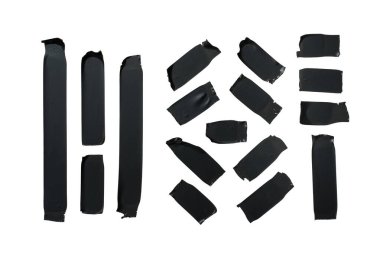 Çok çeşitli siyah elektrik bandı parçaları. izole edilmiş beyaz arkaplan