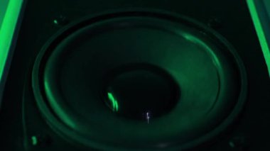 Musical speaker with beautiful color illumination. Music speaker close-up. Lighting to the beat of the music. High quality FullHD footage