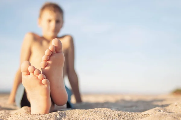 Child European Appearance Sits Sand Beach Close Legs Feet Focus — Stockfoto