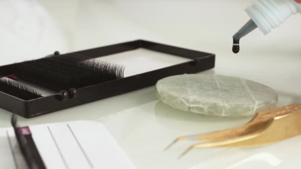 Eyelash Extension Materials Close Glue Dripped Pebble Glue Slow Motion — Vídeos de Stock