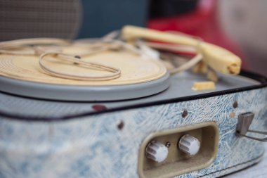 antique turntable for vinyl discs on the table in the room close-up.blue color turntable. High quality photo