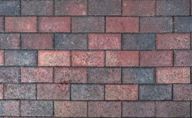 Soyut desenli, kırmızı, eski, taş kaldırım. Yaşlandıkça ufalanır. İnşaat, onarım. Yıkım konsepti, düşüş. Yüksek kalite fotoğraf