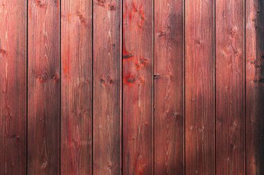 Arkaplan olarak ahşap dokuya sahip tahta tahtalar. Koyu kırmızı tahta duvar. Yüksek kalite fotoğraf