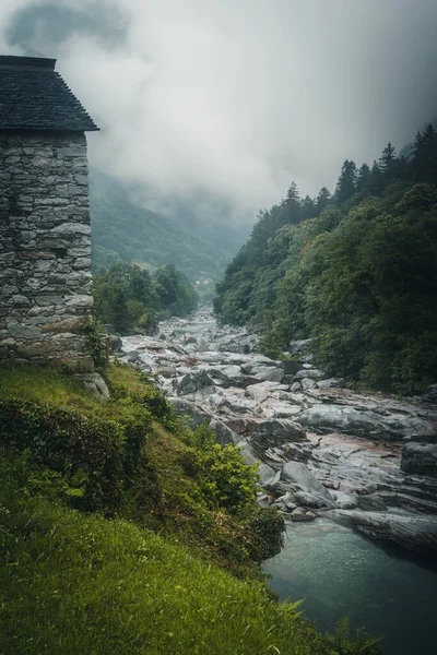 View of Lavertezzo village, famous tourist destination - An old Swiss village with double arch bridge on Ponte dei Salti with waterfall, Lavertezzo, Verzasca Valley