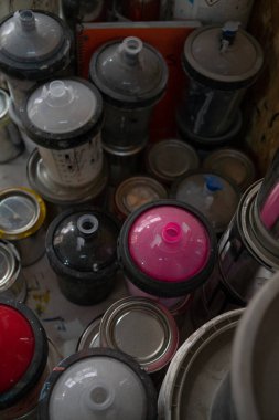 shelf full of paint cans
