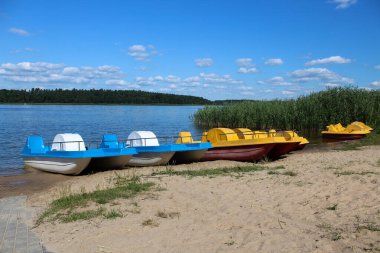 5.08.2022 Augustow Poland.Pedal boats on lake Necko on a beautiful suny day.